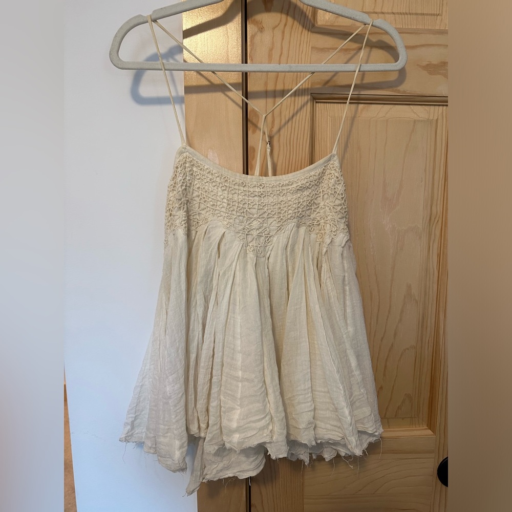 Free People One Medium sized cream colored flowy tank
